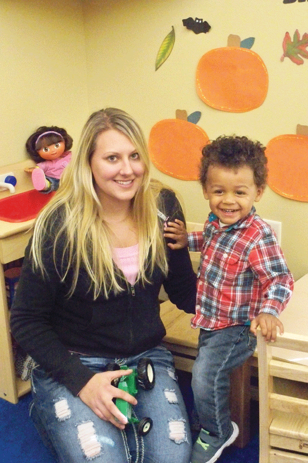 Emily Cook poses in Lakeland daycare with her son, Braylin. 