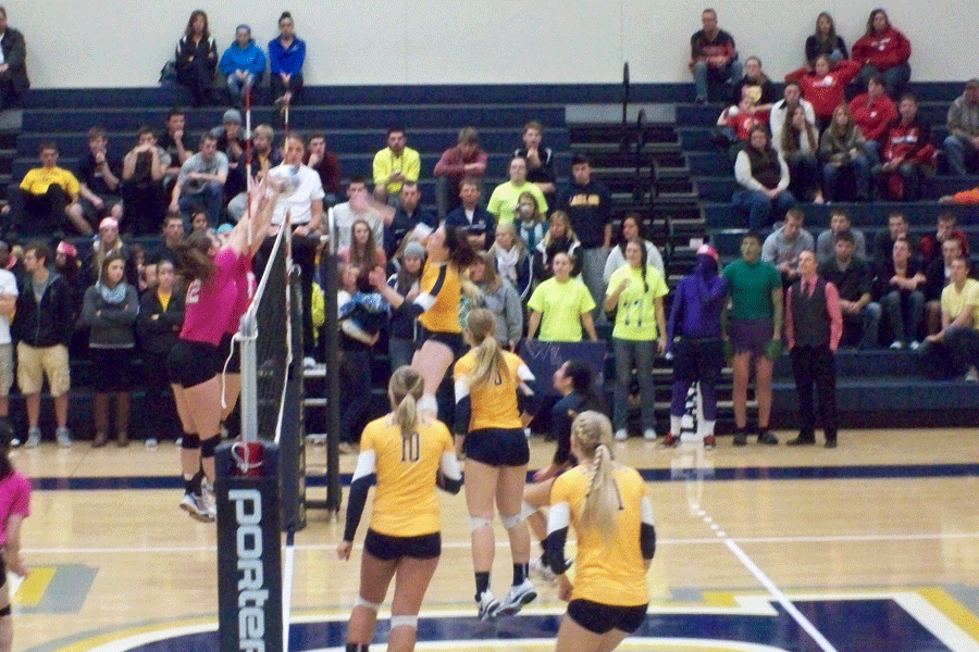 Muskie women hold back their opponents at a recent volleyball game at the Wehr Center.