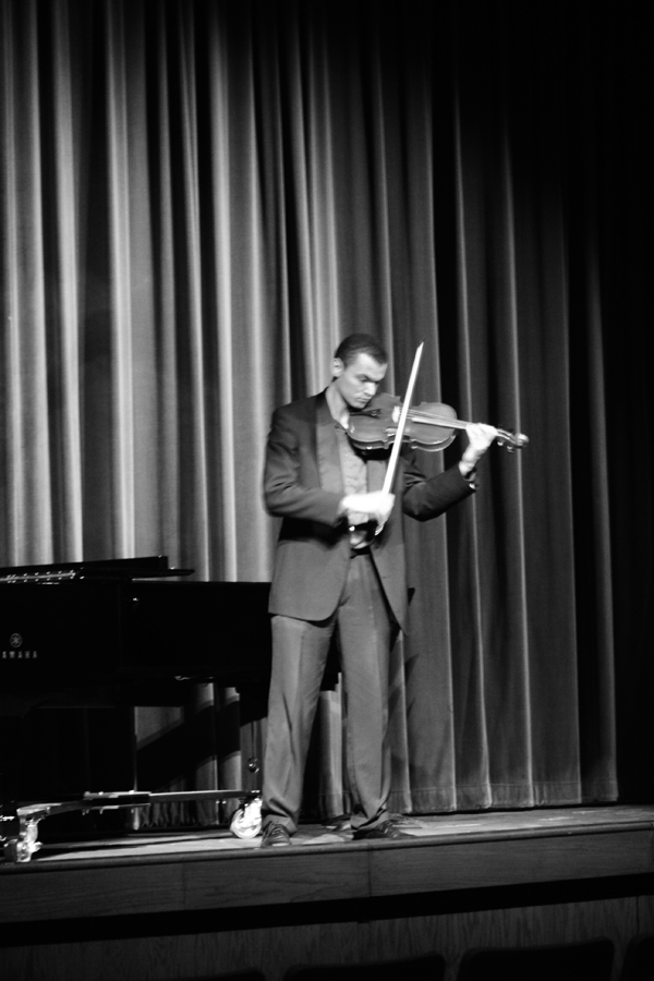 Qamar playing the viola at the honors recital. 