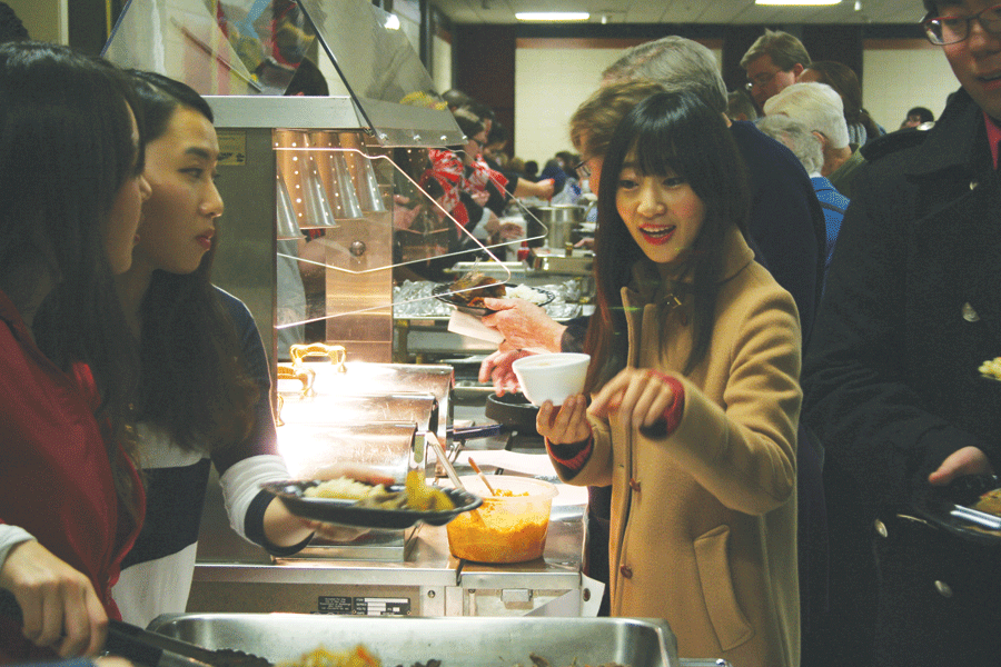 Students and community members come together to sample an array of entrees and desserts.