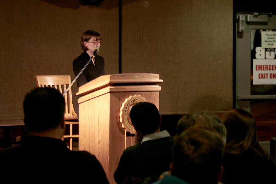 Lenox dazzles the crowd gathered in the pub with her passionate poetry readings.