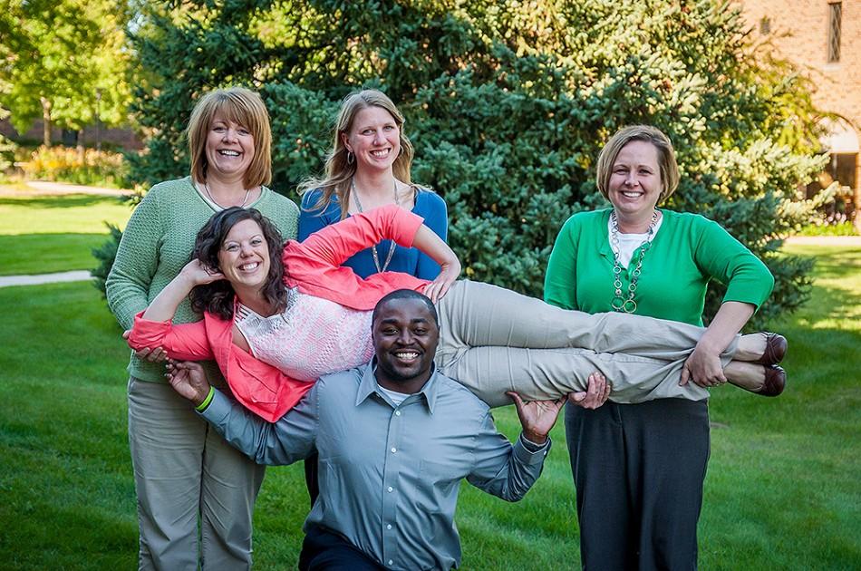 Success Coaches pose outside of the Campus Center. 