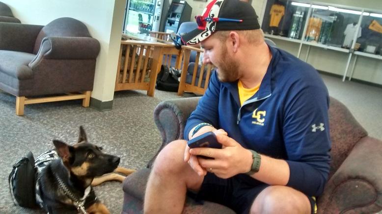 Army veteran Nick Marzahl, freshman psychology and nursing major, trains and uses the services of his service puppy, Duke, on campus.