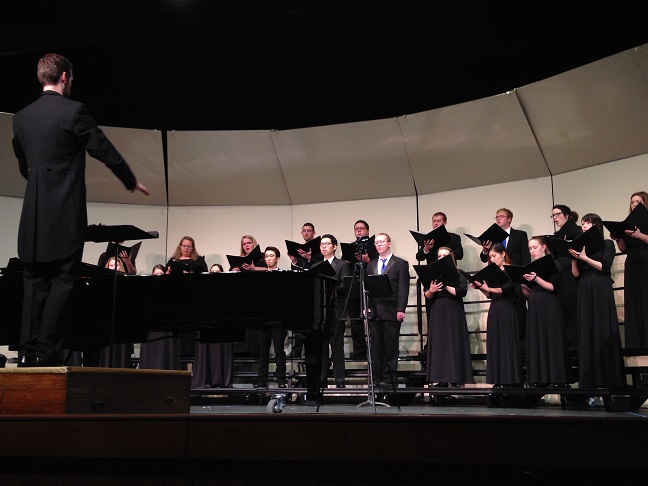 Black+conducts+for+the+Lakeland+Choir+during+an+intense+performance.