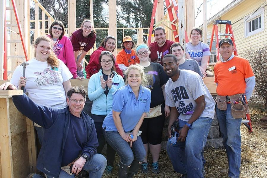 Sizemore poses with Lakeland students during their recent Habitat for Humanity spring break trip.