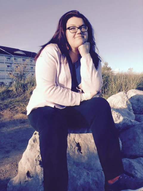 Mayce Bacon, senior writing major, enjoys the view at Blue Harbor as she ponders the mystery of the self.