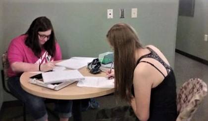 Lauren Bruggink, freshman bio chemistry major, and Shyanne Koski, freshman math education major, hard at work.