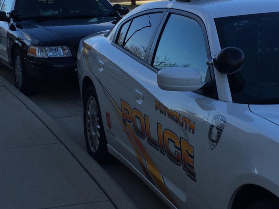 Law enforcement vehicles stationed on campus during the K-9 exercise.